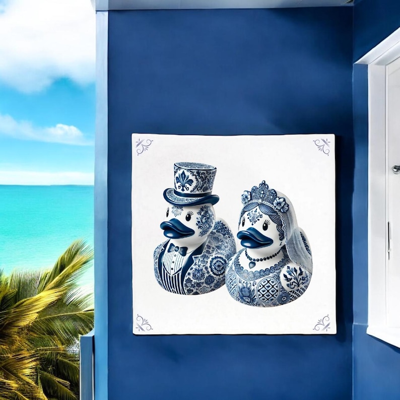 May include: A pair of blue and white ceramic ducks, one wearing a top hat and the other a crown and veil, against a white background.