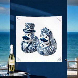 May include: A pair of blue and white ceramic rubber ducks dressed as a bride and groom. The groom duck is wearing a top hat and a tuxedo. The bride duck is wearing a crown and a veil.