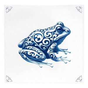 May include: A blue and white decorative tile featuring a detailed illustration of a frog. The frog is adorned with intricate scrollwork patterns. The tile has decorative corner accents.