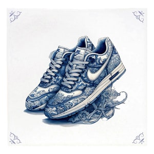 May include: A pair of white sneakers with a blue and white floral pattern. The sneakers are on a white background.