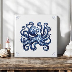 May include: Blue and white ceramic tile featuring a detailed illustration of an octopus with floral patterns. The octopus has eight tentacles and is depicted in a stylised, decorative manner.