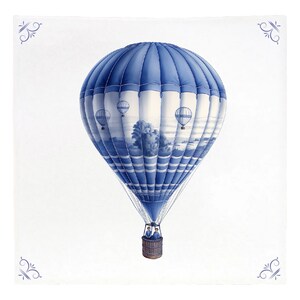 May include: A blue and white hot air balloon with two people in the basket. The balloon is flying over a landscape with trees and clouds. There are three smaller balloons in the background.