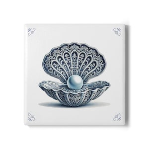 May include: A white ceramic tile with a blue and white illustration of a pearl inside a detailed, ornate seashell.