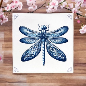 May include: A blue dragonfly with intricate, detailed patterns on its wings. The dragonfly is drawn in a detailed, realistic style on a white background.