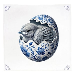 May include: A blue and white porcelain egg with a floral design, cracked open to reveal a small grey bird inside.
