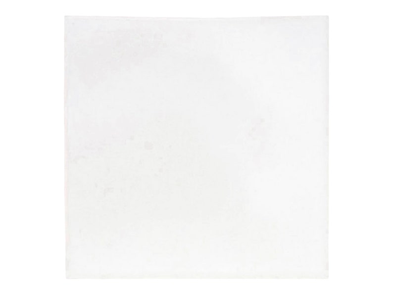 May include: A plain white square piece of paper.