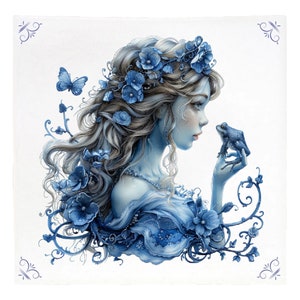 May include: A blue and white illustration of a woman with long flowing hair wearing a crown of blue flowers. She is holding a blue frog in her hand and looking at it. The background is white with blue floral designs.