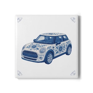 May include: A white mini cooper car with blue and white floral designs on the exterior. The car is on a white background.