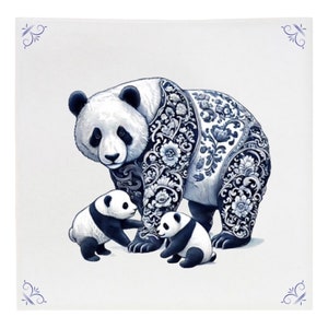 May include: A white and black panda bear with blue and white floral patterns on its fur, standing with two smaller panda cubs. The background is a light grey.