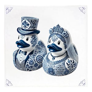 May include: A pair of blue and white ceramic rubber ducks dressed as a bride and groom. The groom duck is wearing a top hat and a tuxedo. The bride duck is wearing a crown and a veil.