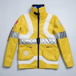 May include: A bright yellow jacket featuring a high collar with a black buckle, silver reflective quilted bands across the chest and sleeves, two front pockets, and red and white Star of Life emblems on the shoulder and chest area.