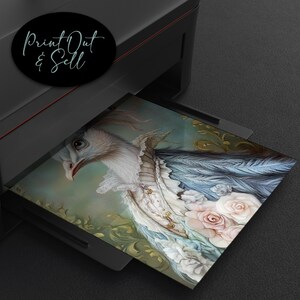 May include: A square print featuring a detailed illustration of a bird with white and blue feathers, adorned with a ruffled collar and floral accents. The print is emerging from a printer, with the text "Print Out & Sell" in a black circle.