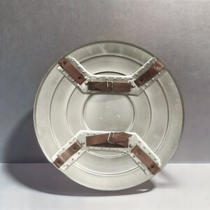 May include: The back of a silver Captain America shield with brown leather straps and buckles. The shield has the word "cospider" printed on it.
