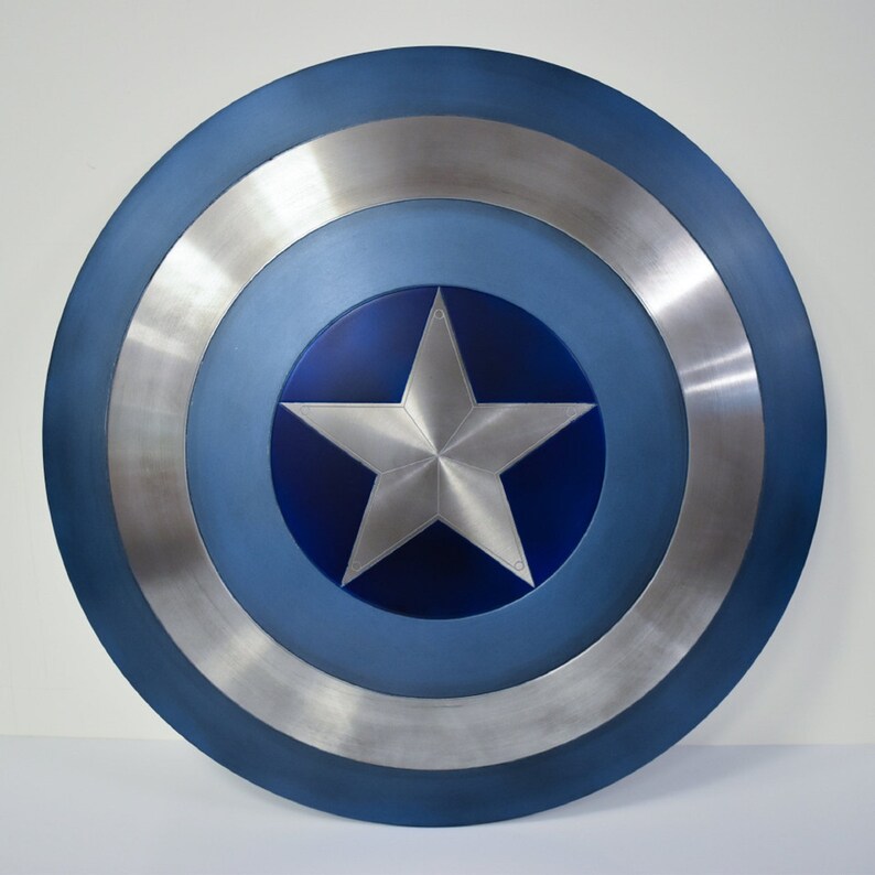 May include: A blue and silver Captain America shield with a white five-pointed star in the center.