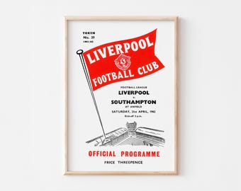 May include: A vintage red and black Liverpool Football Club programme from 21st April 1962. The programme features a red banner with the team's logo and the text "Liverpool Football Club". The programme also includes information about the game, including the opponents, Southampton, and the date and time of the match. The programme is priced at three pence.