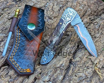 Navaja plegable de cobre de Damasco, hecha a mano y personalizada, con mango de palisandro y funda de cuero.