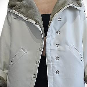 May include: A white jacket with a faux fur-lined hood and cuffs. The jacket features snap closures and two front pockets. The lining of the hood and cuffs is a light brown color. The jacket is made of a smooth, possibly water-resistant material.