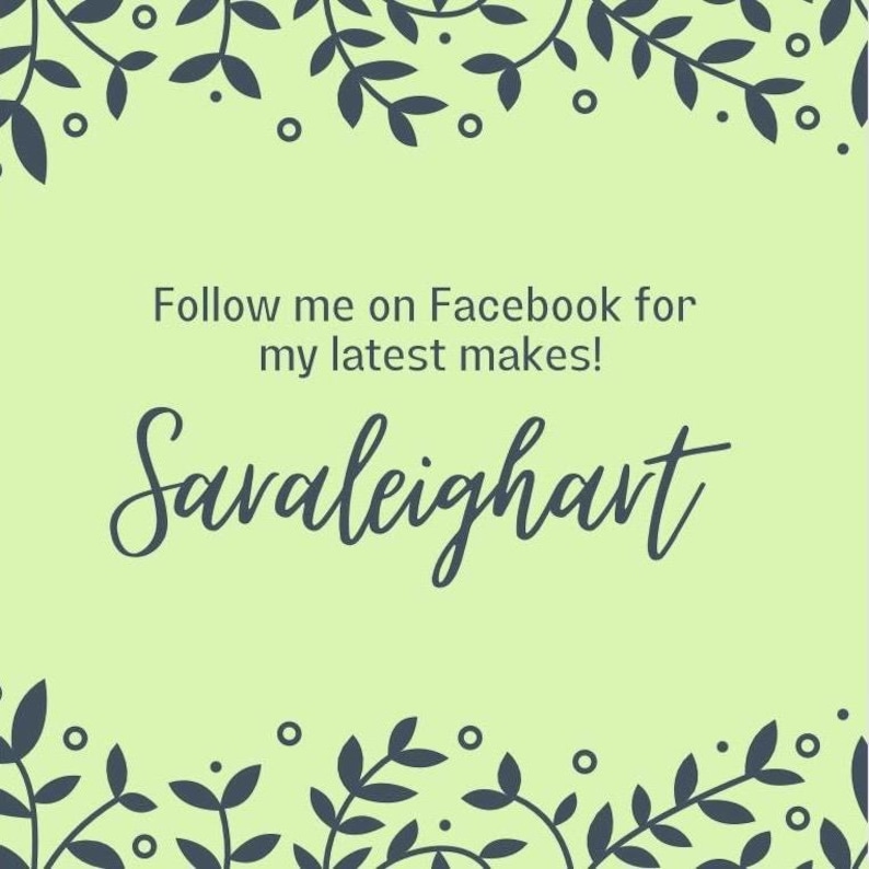 May include: A green background with a dark blue floral border. The text 'Follow me on Facebook for my latest makes!' and 'Saraleighart' is written in dark blue cursive font.