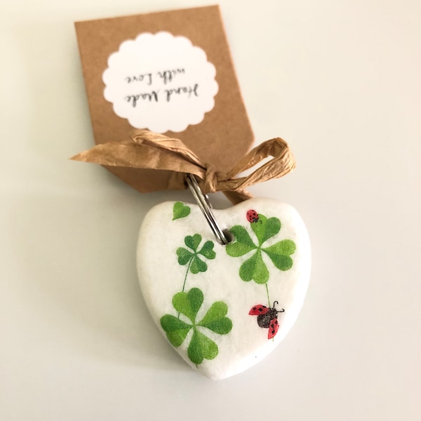 Good luck keyring. Stone heart shape keyring featuring decoupage four leaf clovers and ladybirds print. Good luck gift.