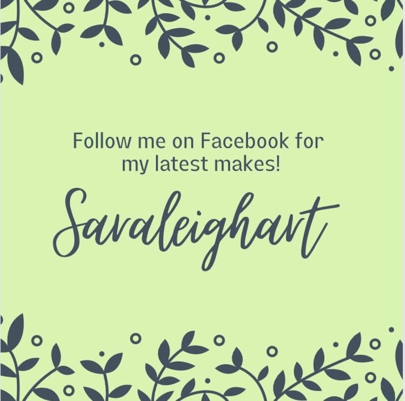May include: A light green background with a dark blue floral border. The text 'Follow me on Facebook for my latest makes!' is in dark blue text. The text 'Saraleighart is in a large, dark blue, cursive font.