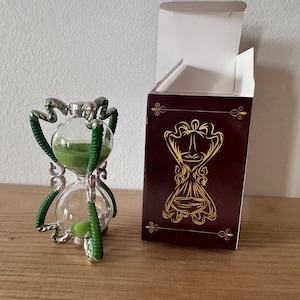 Professor Slughorn's Hourglass – Harry Potter Inspired Replica Professor Slughorn's Hourglass – Harry Potter Inspired Replica