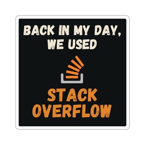 May include: A square sticker with a black background featuring the white text "BACK IN MY DAY, WE USED" at the top, an orange icon of a stack of blocks in a grey tray in the centre, and the orange text "STACK OVERFLOW" at the bottom.