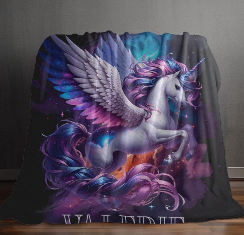 May include: A plush blanket featuring a majestic white unicorn with large, detailed wings and a flowing mane and tail in shades of purple and blue. The background is a vibrant nebula of purples, blues, and oranges, creating a fantasy theme.