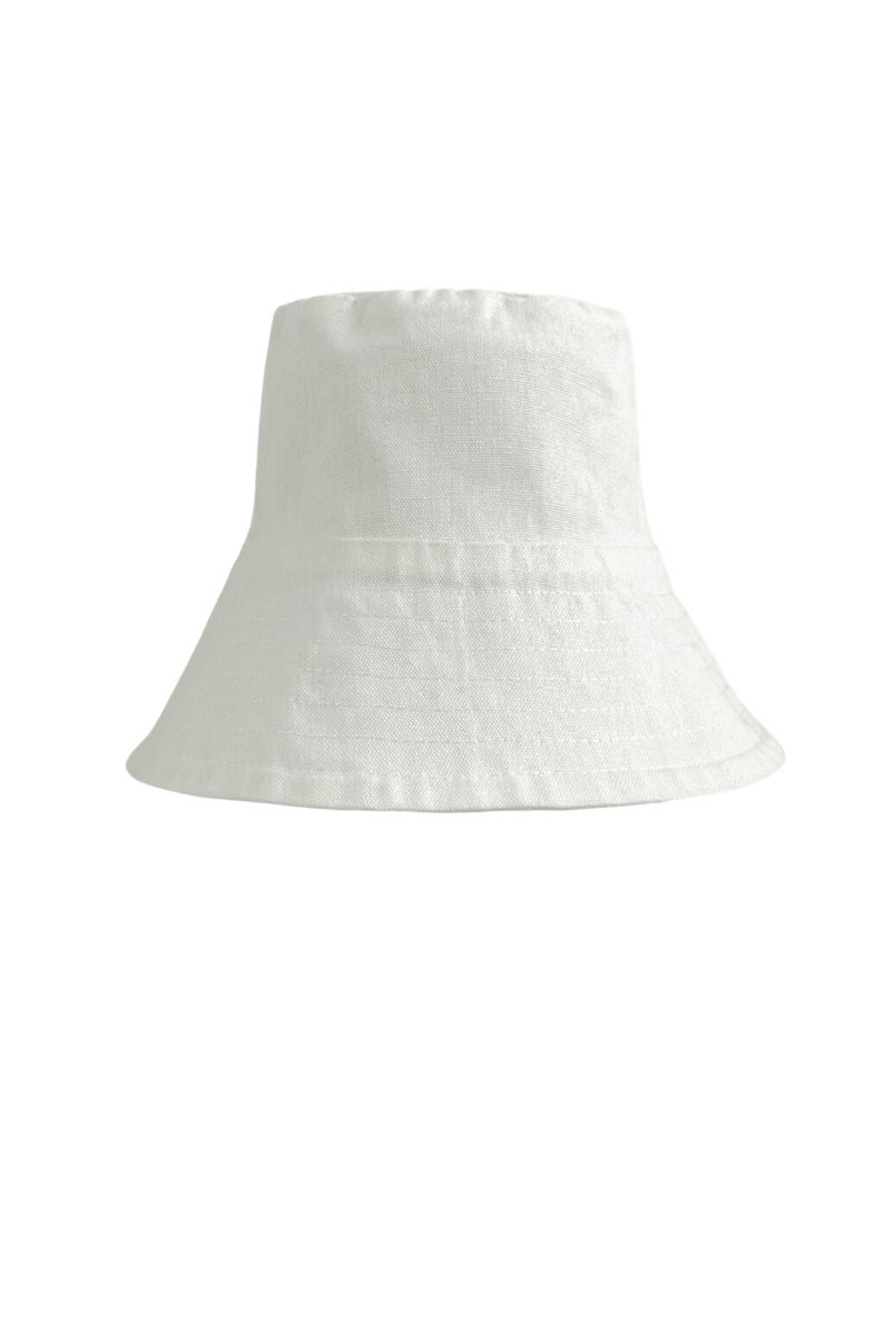 White organic Bucket hat with large brim and moon embroidered on top by Carmen Calburean.