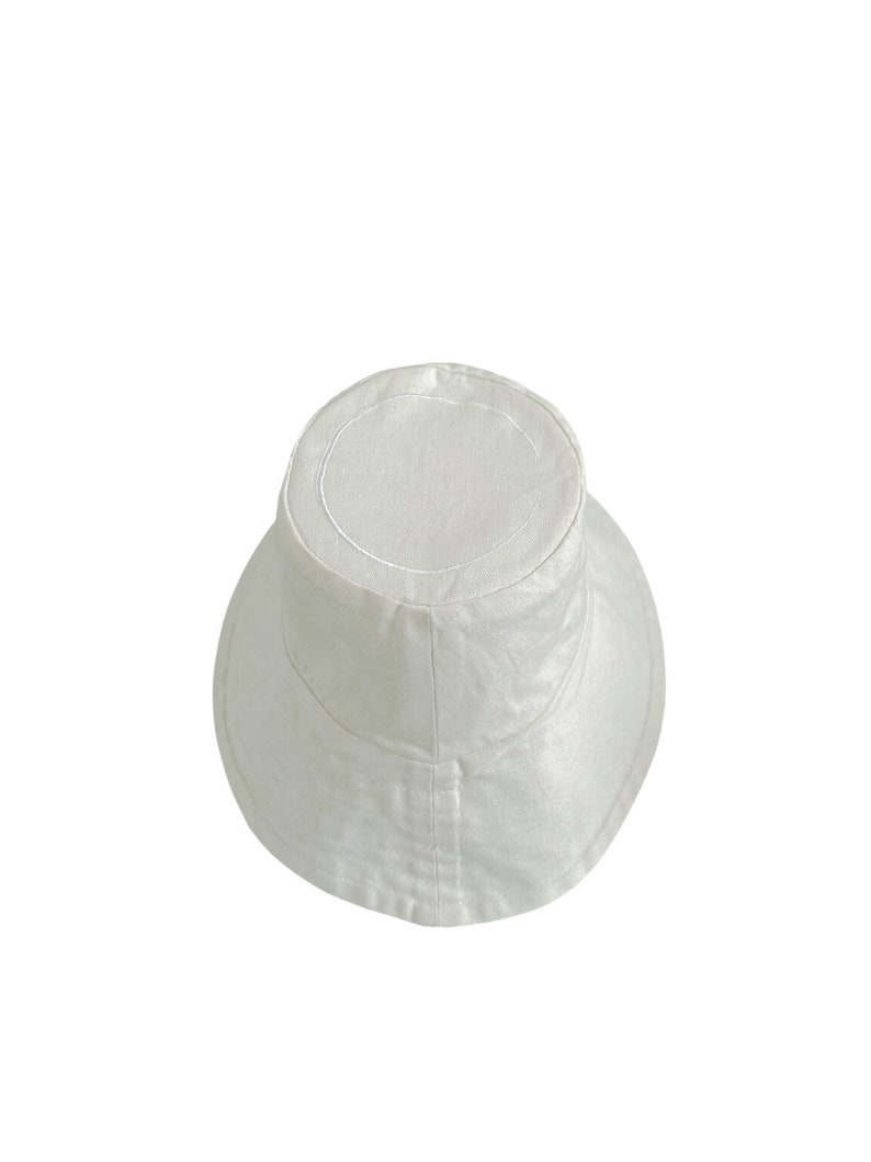 White organic Bucket hat with large brim and moon embroidered on top by Carmen Calburean.