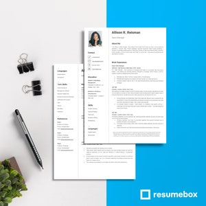 May include: A professional resume template with a headshot, contact information, and work experience details. The resume is accompanied by a second page, a pen, and binder clips. The resume is for Allison R. Reisman, Sales Manager.