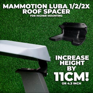 May include: Black roof spacer with the text "MAMMOTION LUBA 1/2/2X ROOF SPACER" and "FOR HIGHER MOUNTING". The image shows the spacer increasing height by 4.3 inches. The background is green.