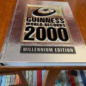 Book Guinness World Records 2000 Hardcover Book Millennium Edition plus free Time Travel Guides