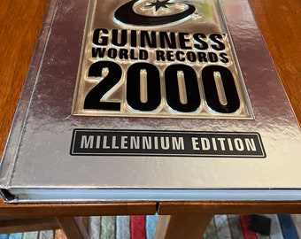 Book Guinness World Records 2000 Hardcover Book Millennium Edition plus free Time Travel Guides