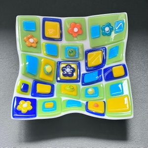 Fused glass art dish. Colorful art glass bowl. Geometric shapes on a handmade dish. Flowers. Fluted glass dish. Entertaining dishes. Foodie gift. Gift for mom. Green and blue dinnerware. Cottage core. Anniversary gift. Limited Edition.