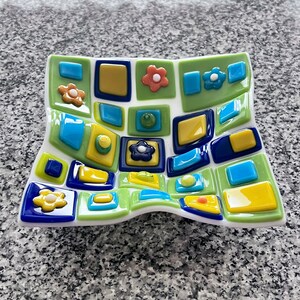 Fused glass art dish. Colorful art glass bowl. Geometric shapes on a handmade dish. Flowers. Fluted glass dish. Entertaining dishes. Foodie gift. Gift for mom. Green and blue dinnerware. Cottage core. Anniversary gift. Limited Edition.