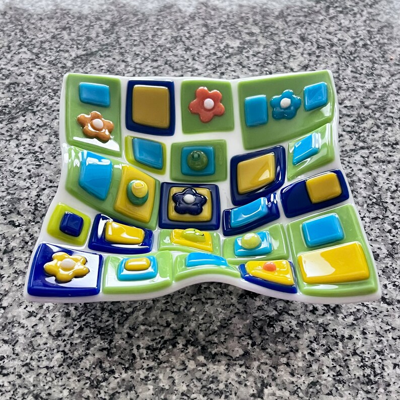 Fused glass art dish. Colorful art glass bowl. Geometric shapes on a handmade dish. Flowers. Fluted glass dish. Entertaining dishes. Foodie gift. Gift for mom. Green and blue dinnerware. Cottage core. Anniversary gift. Limited Edition.