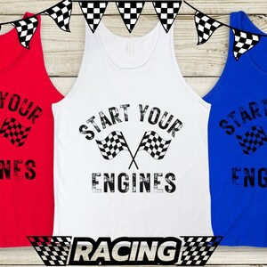 May include: Three tank tops with the phrase "Start Your Engines" printed in black with a checkered flag graphic. The tank tops are red, white, and blue.