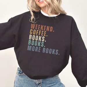 May include: Black sweatshirt with a vintage-style graphic that reads "Weekend. Coffee. Books. Books. More Books."