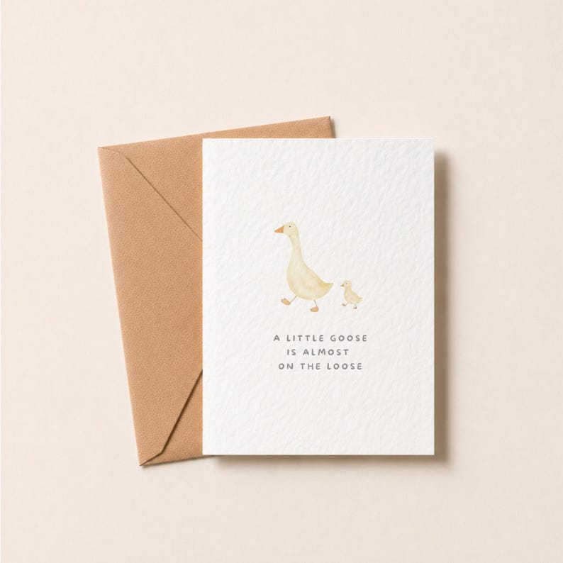 Baby Shower Card | Little Goose Illustration | Hammered Card | baby girl card | baby boy card - May include: A white greeting card featuring a watercolour illustration of an adult goose and a gosling. The text reads A LITTLE GOOSE IS ALMOST ON THE LOOSE. The card is accompanied by a brown kraft paper envelope, with a textured paper finish.