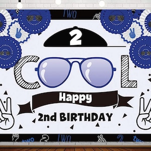May include: A white and black birthday banner with blue and white decorations. The banner says "Cool" with a pair of sunglasses and "Happy 2nd Birthday".