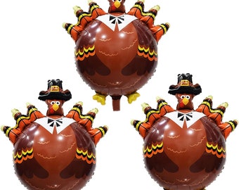 May include: Three brown and orange inflatable Thanksgiving turkeys with pilgrim hats. The turkeys are wearing white collars and have a brown and orange feather pattern.