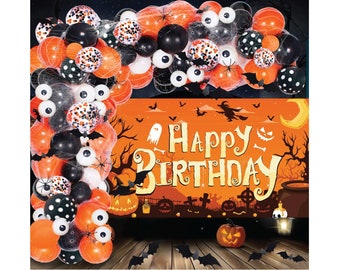 May include: Halloween birthday party decorations with orange, black, and white balloons, a banner that says "Happy Birthday", and a spooky Halloween scene with a cauldron, bats, and a ghost.