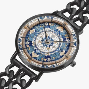May include: A black wristwatch with a chain-link band. The watch face features a detailed floral design in shades of blue, white, and gold. The watch hands are black, and the case is black. The watch has a classic, elegant style.