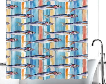 May include: A shower curtain featuring a repeating pattern of watercolor fish against a backdrop of vertical stripes in blue, orange, and yellow. The fish are depicted in shades of blue, purple, and red, creating a nautical theme.