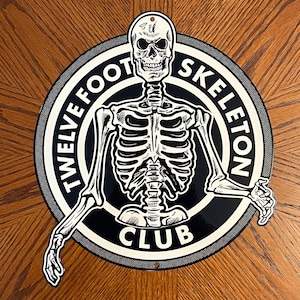 Twelve Foot Skeleton Club Metal Sign