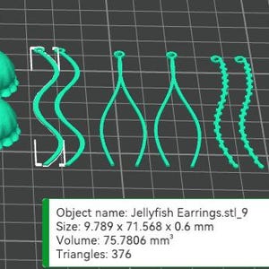 May include: A 3D printed set of turquoise blue jellyfish earrings. The earrings are made up of two parts: a round, textured jellyfish body and a long, thin, dangling tentacle. The tentacles are available in a variety of styles, including wavy, straight, and beaded.