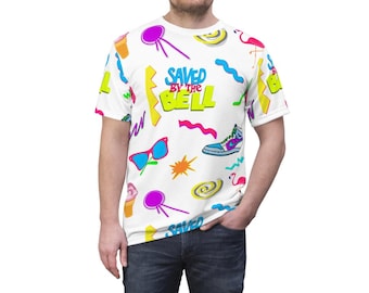 May include: A white t-shirt with a colorful 90s-inspired print featuring the words "Saved by the Bell" and various icons like ice cream cones, sunglasses, flamingos, and a basketball shoe.