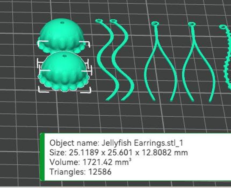 May include: A pair of turquoise blue jellyfish earrings. The earrings are made of 3D printed plastic and feature a detailed jellyfish design. The earrings are approximately 2.5 inches in length.