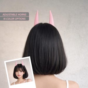 May include: A person's back is shown, wearing a black wig with pink adjustable horns. The image includes a small photo of a person wearing the horns. Text on the image reads: "ADJUSTABLE HORNS" and "15 COLOR OPTIONS."