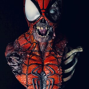 May include: A detailed bust of a zombie Spider-Man with a ripped, decaying red and black costume. The bust is mounted on a black base with a silver plaque that reads "Marvel Zombies R.I.P."